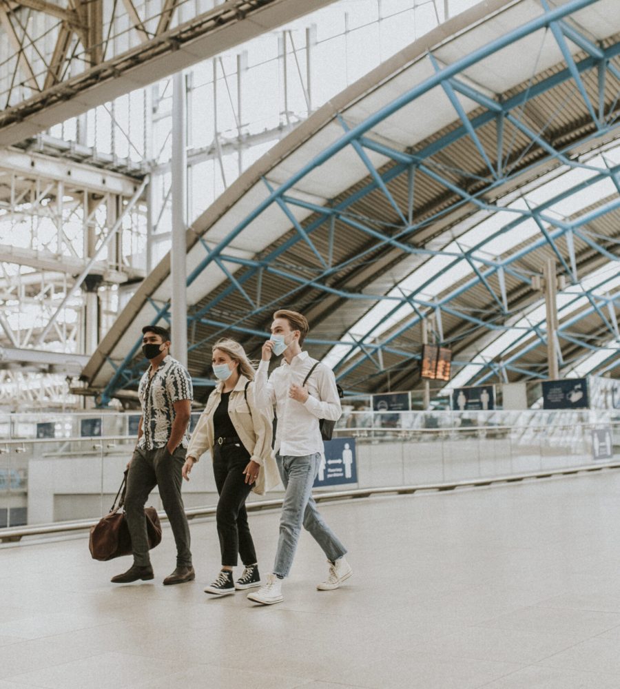 Friends walking towards a train station